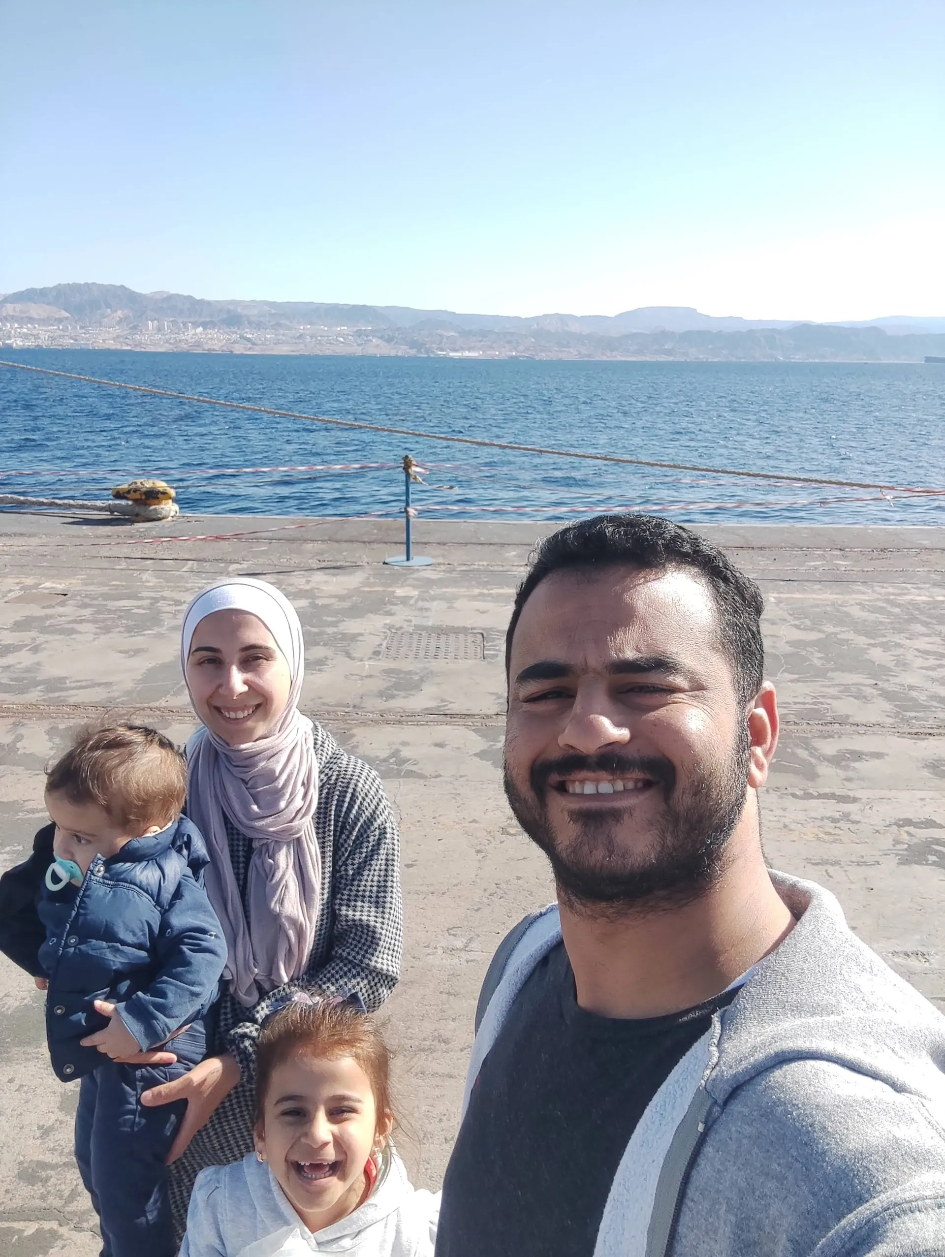 Suhaila and Family smiling in their kitchen