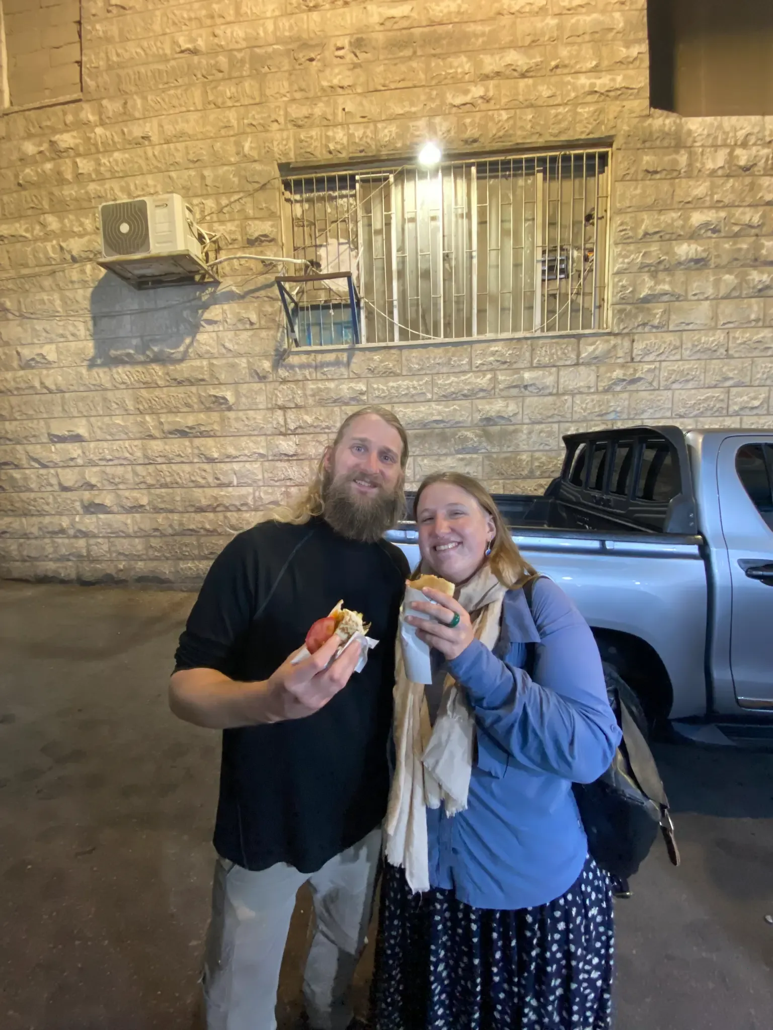 Guests enjoying vegan fries and eggplant sandwiches at Abu Rebhi