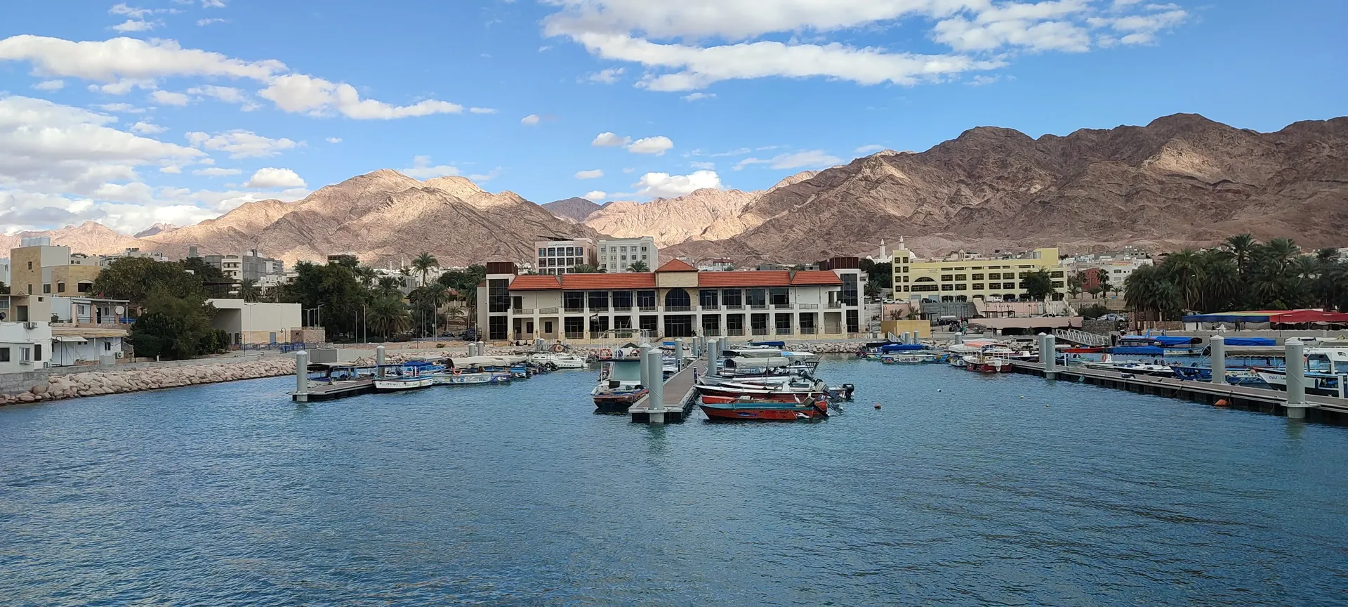 Aqaba Corniche at night with lights reflecting on water